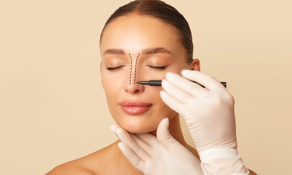 Doctor,Making,Marks,On,Female,Nose,,Young,Woman,Posing,On